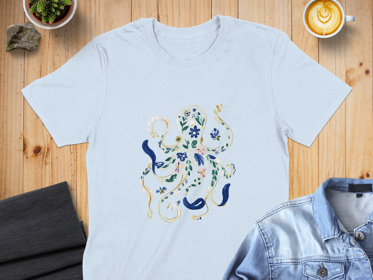 Light blue t-shirt with an illustration of an octopus made of flowers and leaves.
