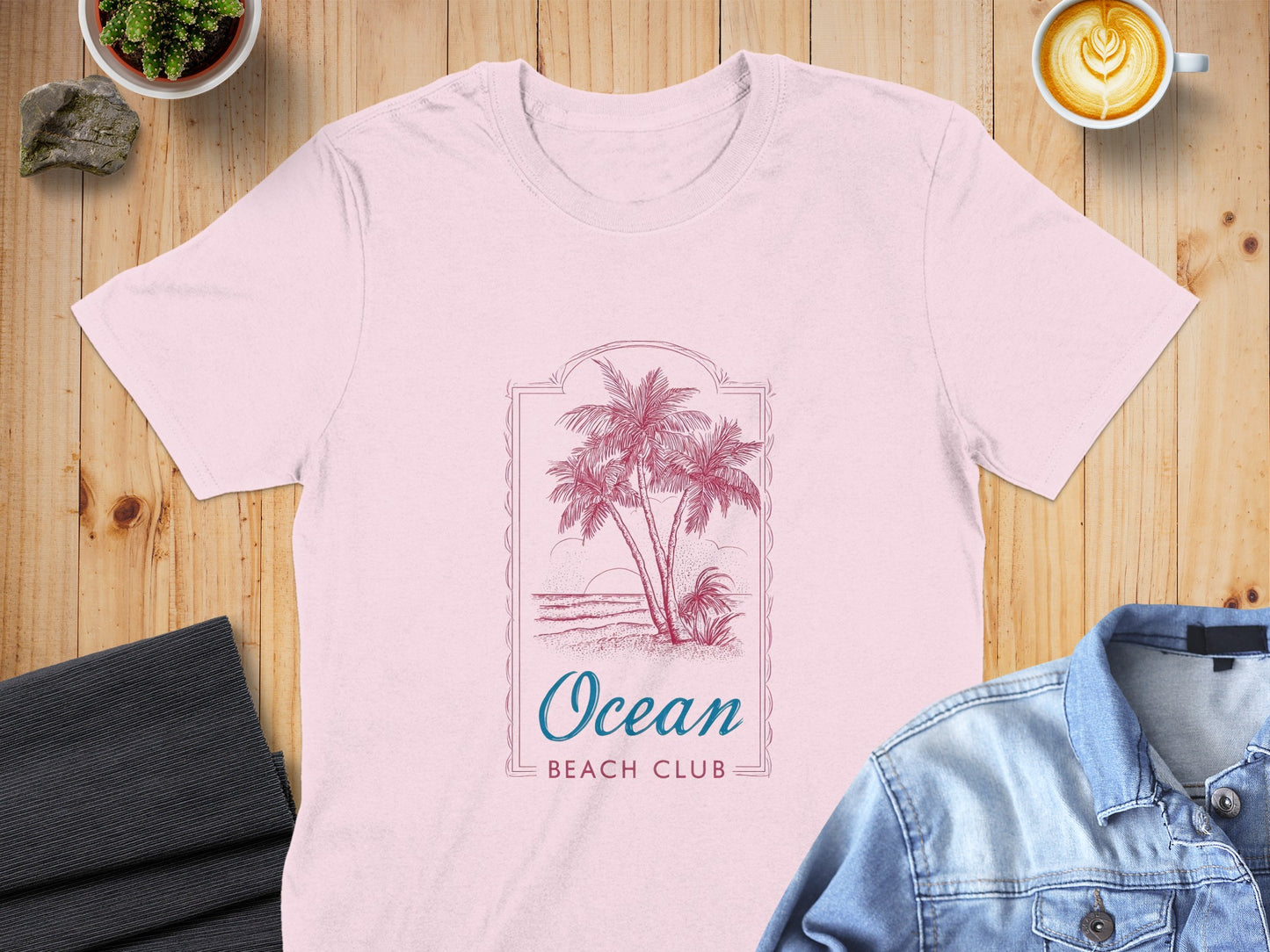 Pink t-shirt with "Ocean Beach Club" text and palm trees.