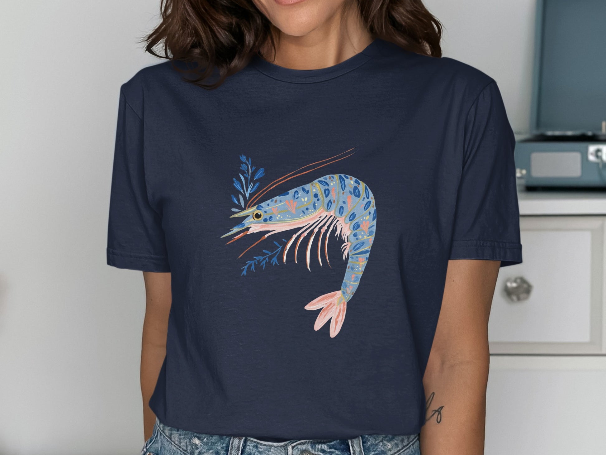 Navy t-shirt with a colorful shrimp and coral design.
