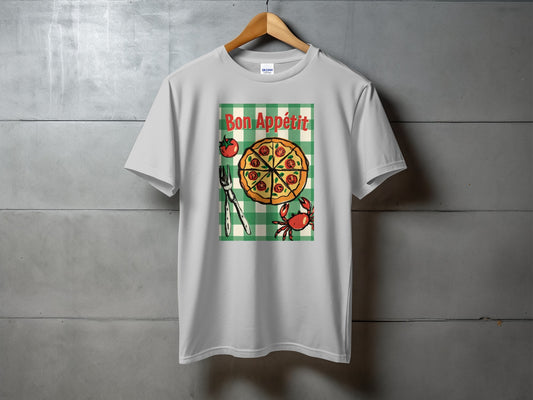 White t-shirt with "Bon Appétit" text above a pizza slice and crab illustration.