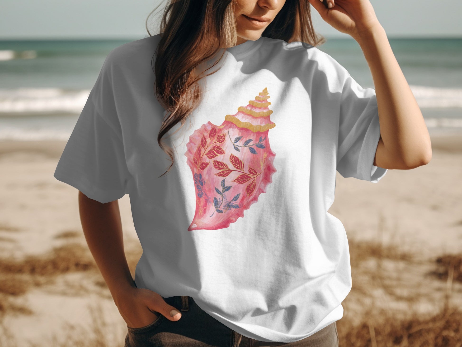 White t-shirt with watercolor pink seashell and floral design.