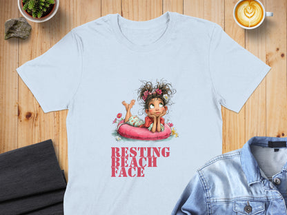 Light blue t-shirt with girl on inflatable tube and text "RESTING BEACH FACE".