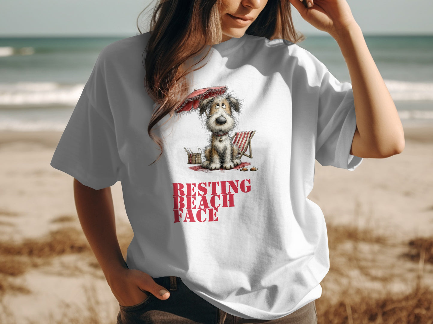White t-shirt with cartoon dog wearing sunglasses, sitting on beach chair, "Resting Beach Face" text.