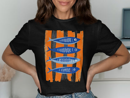 Black t-shirt with four stylized blue fish on an orange striped background.