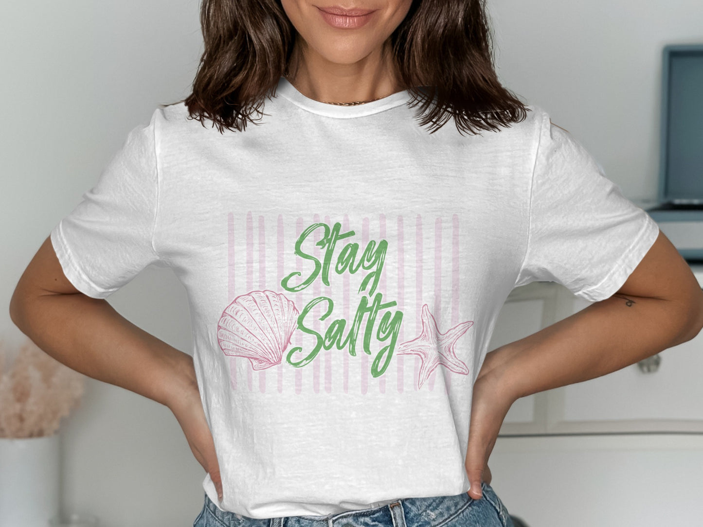 White t-shirt with "Stay Salty" text, a seashell, and a starfish.