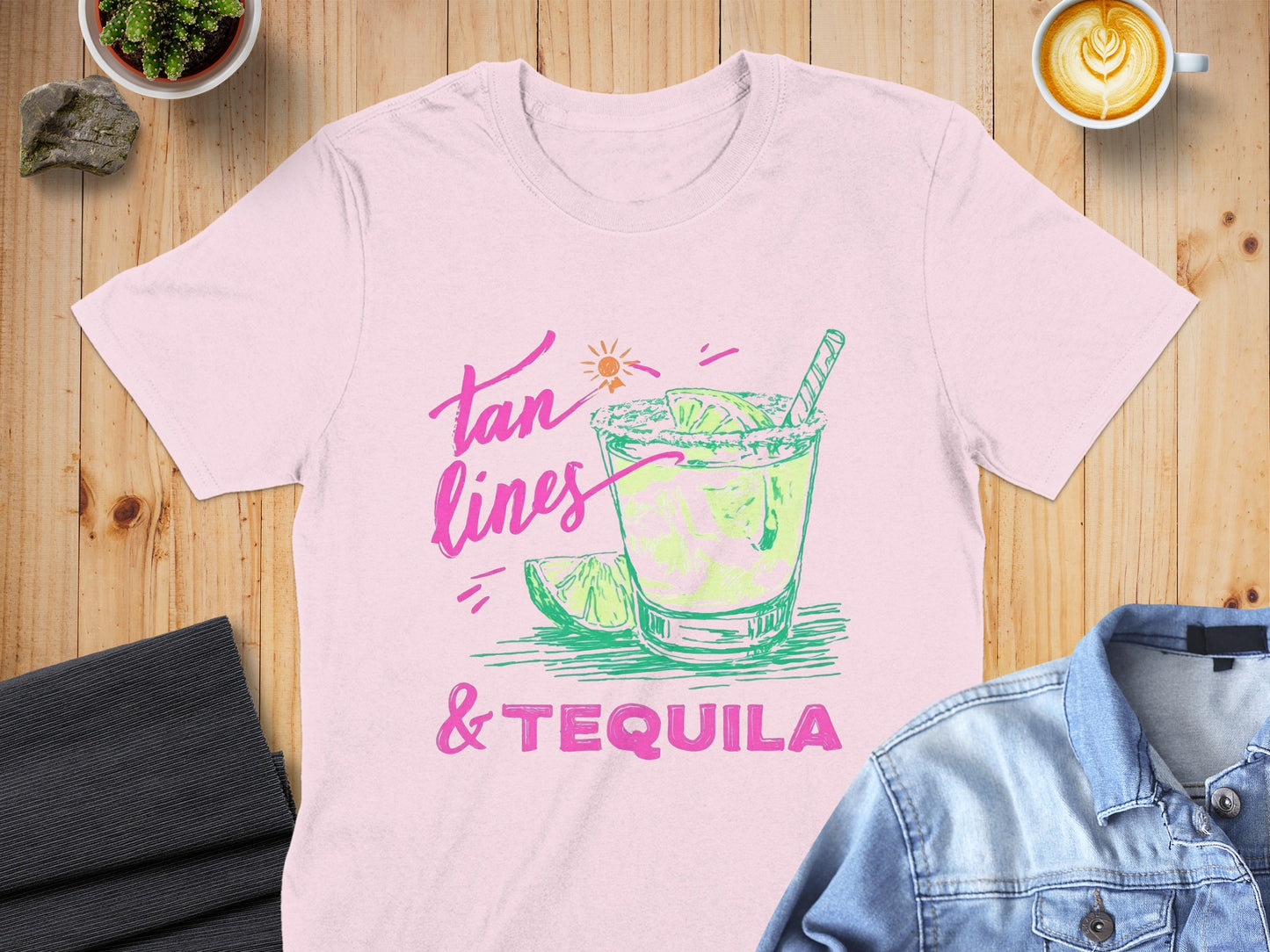 Pink t-shirt with "Tan Lines & Tequila" text and a lime margarita graphic.