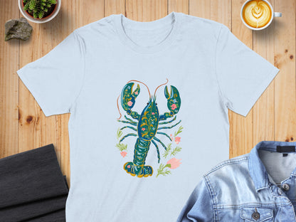 Light blue t-shirt featuring a blue and gold ornate lobster with floral accents.