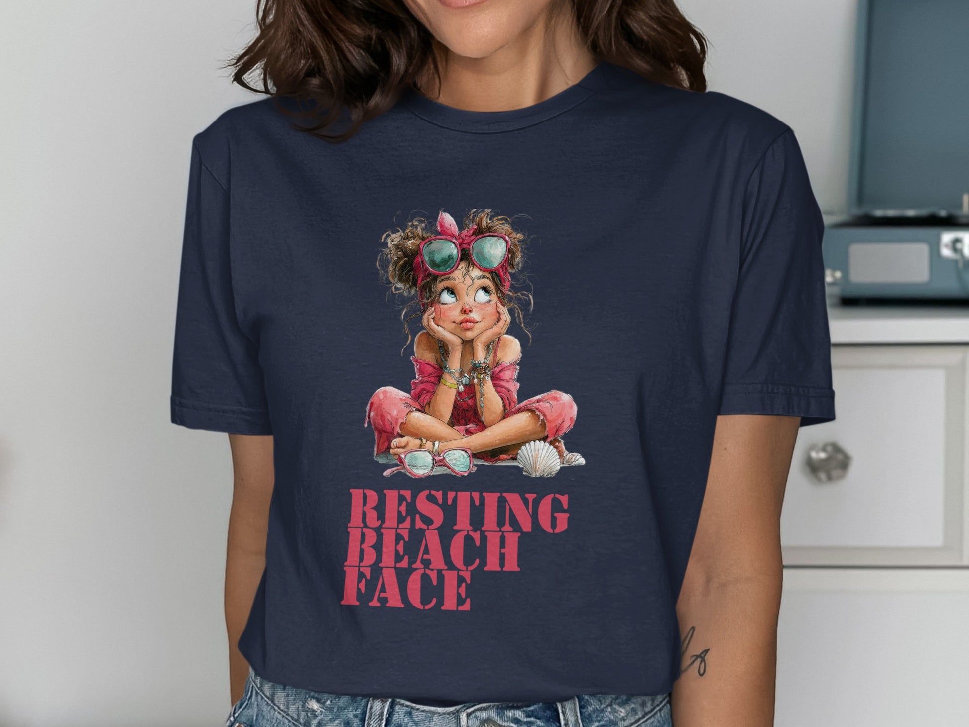 Navy t-shirt with illustration of girl wearing sunglasses and "RESTING BEACH FACE" text.