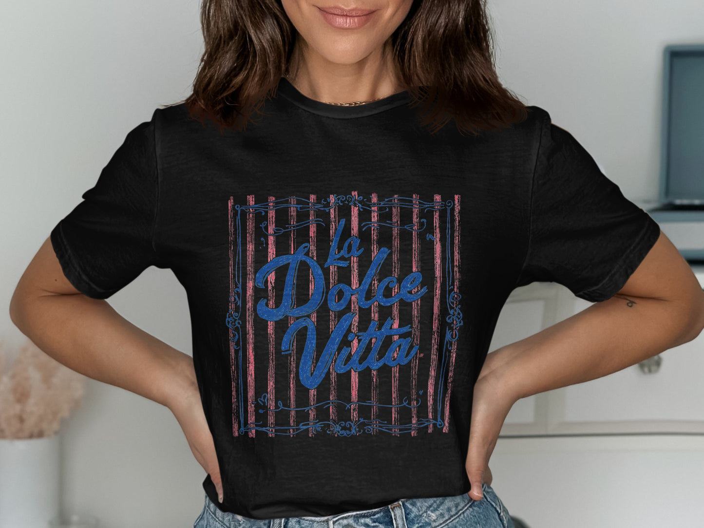 Black t-shirt with "La Dolce Vita" text within a decorative border.