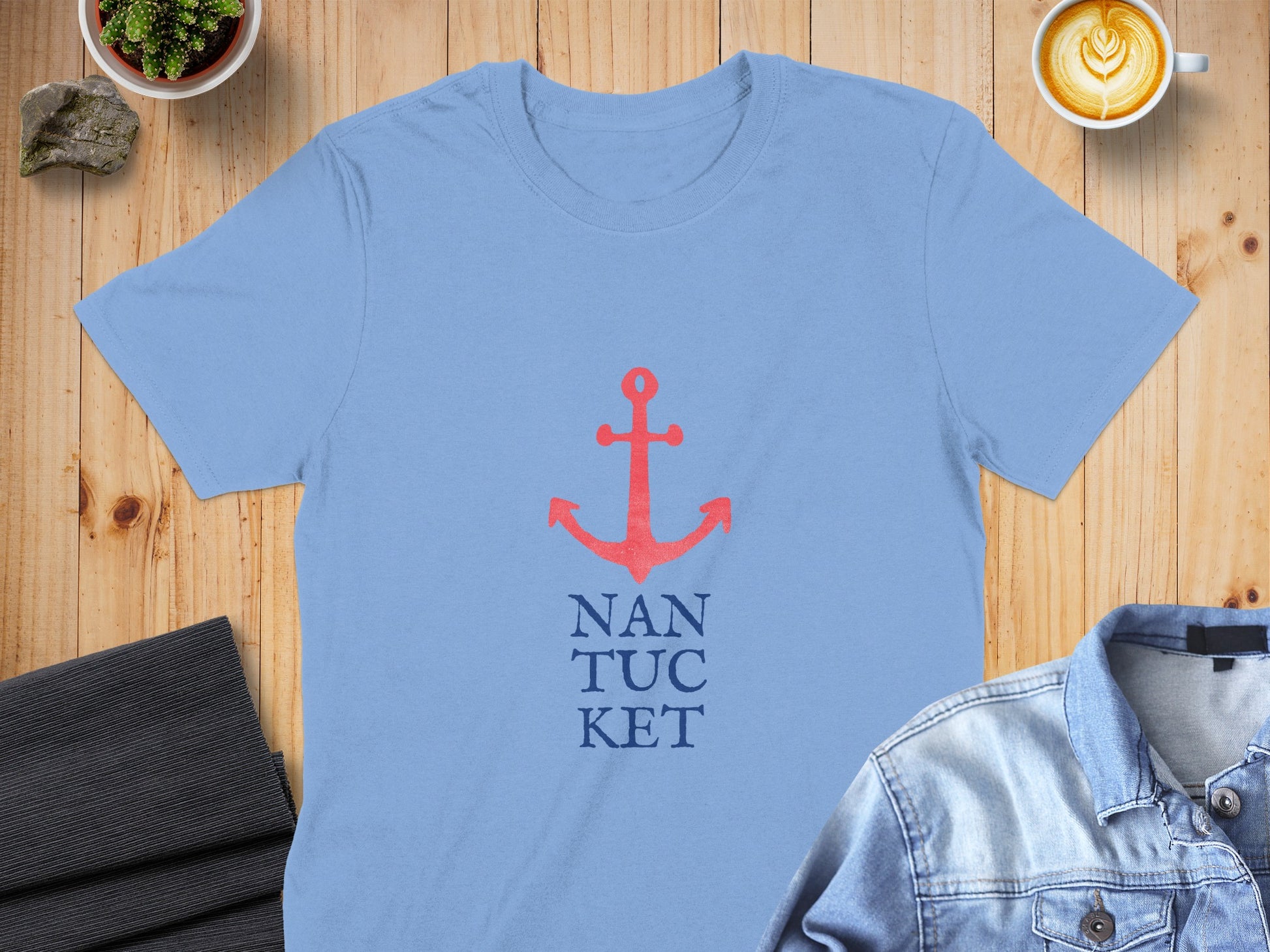 Light blue t-shirt with red anchor and "NANTUCKET" text.