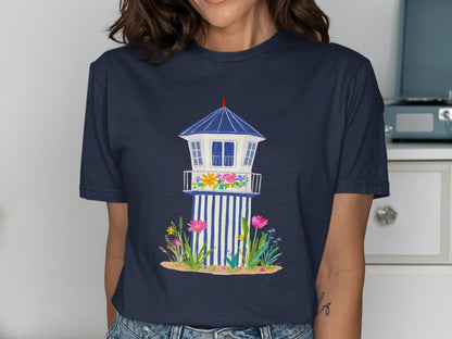 Navy t-shirt with illustration of a beach lifeguard tower with flowers.