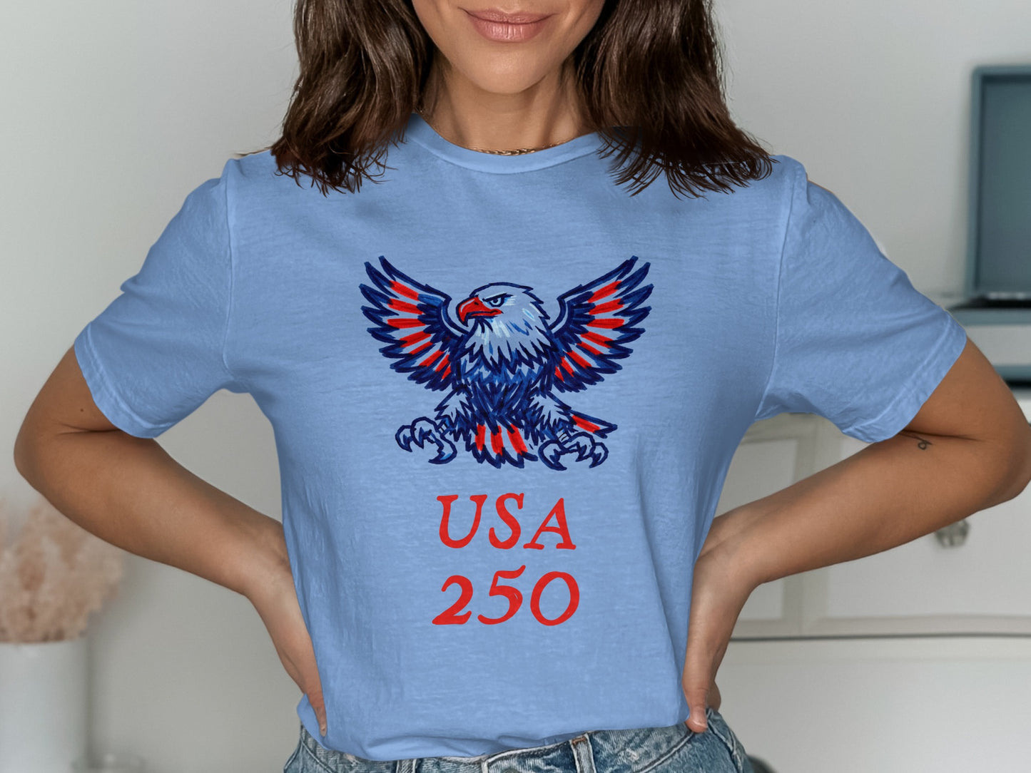 Light blue t-shirt with red and blue eagle and "USA 250" text.