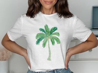 White t-shirt with a green palm tree graphic.