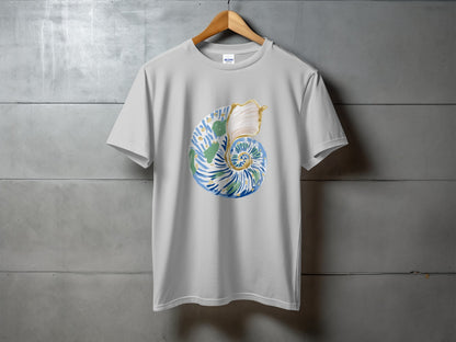 White t-shirt with a blue, green, and gold seashell graphic.