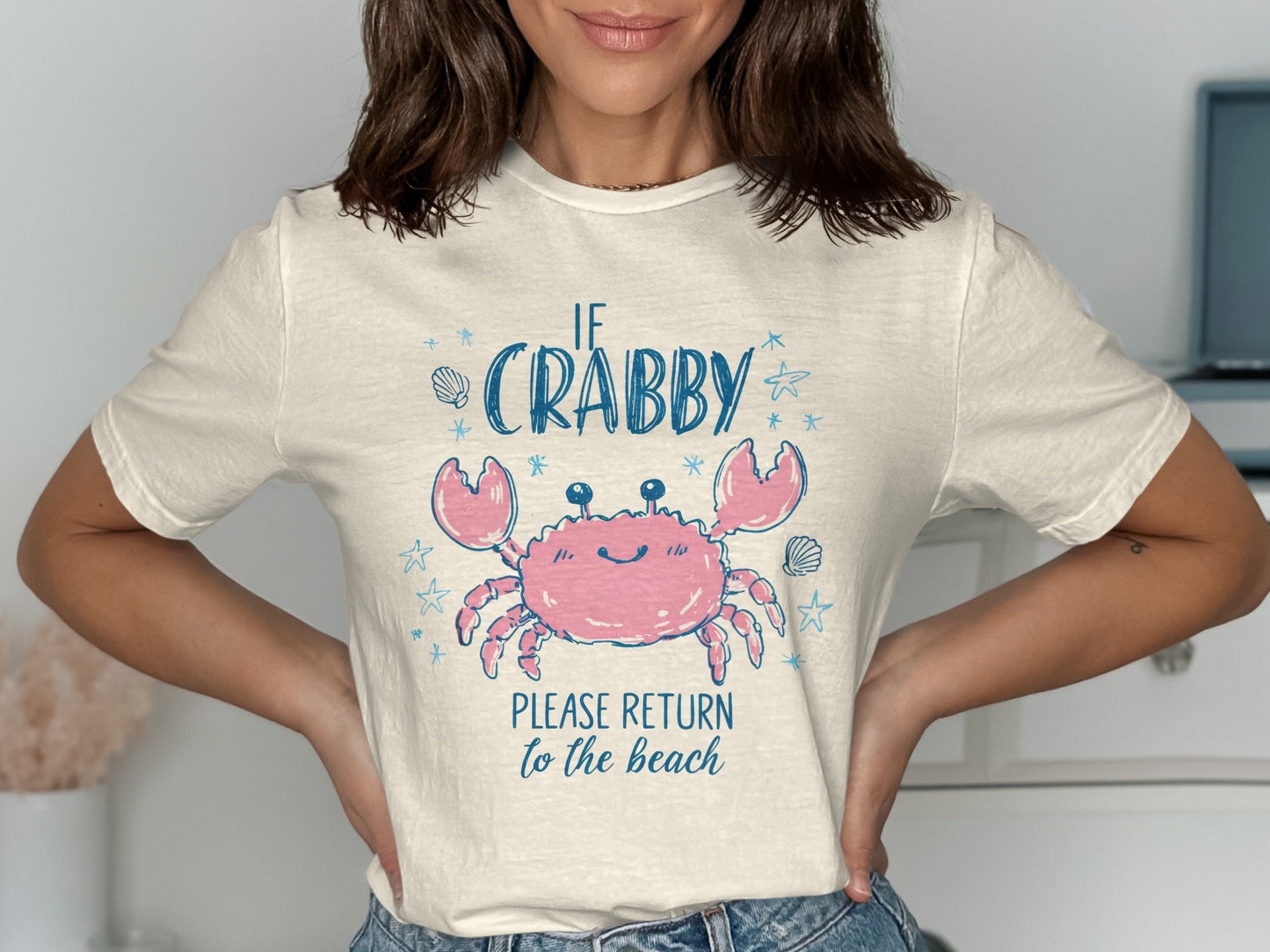 Cream t-shirt with pink crab graphic and text "IF CRABBY PLEASE RETURN to the beach".
