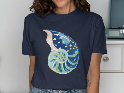 Navy t-shirt with a colorful nautilus shell graphic.