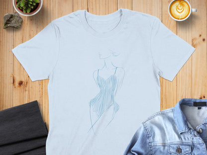 Light blue t-shirt with a minimalist line drawing of a woman in a dress.