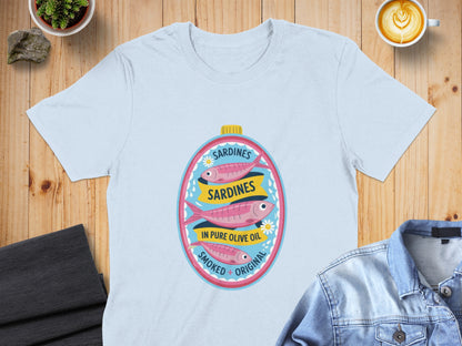 Light blue t-shirt featuring oval graphic of three pink sardines in oil.