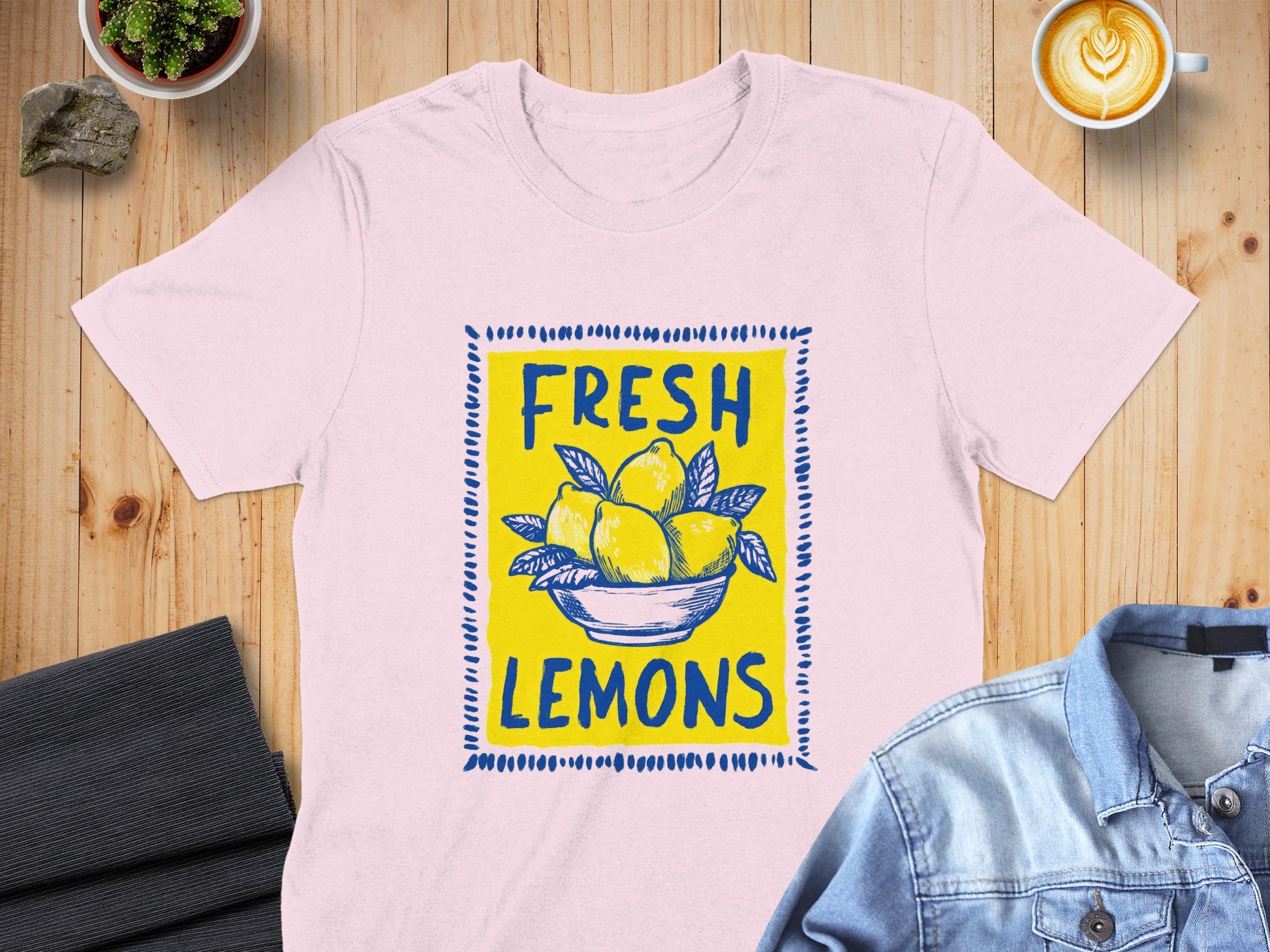 Pink t-shirt with "FRESH LEMONS" in yellow text and lemon illustration.