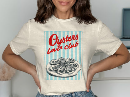 White t-shirt with graphic of oysters on a plate and "Oysters Lover Club" text.