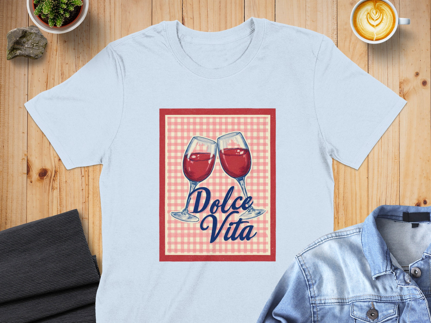 Light blue t-shirt with "Dolce Vita" text and two wine glasses.
