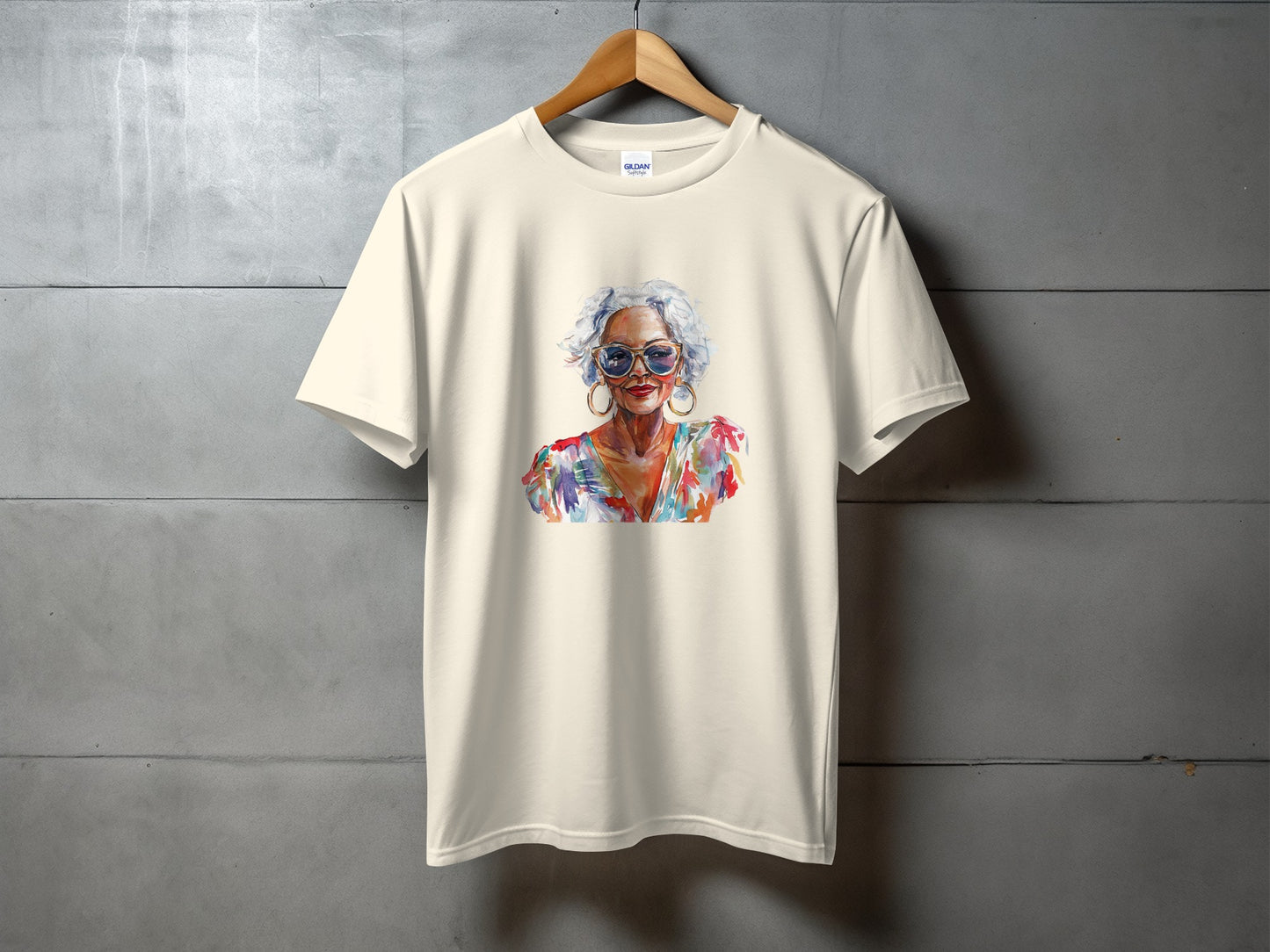 Cream t-shirt with watercolor portrait of a woman wearing sunglasses.