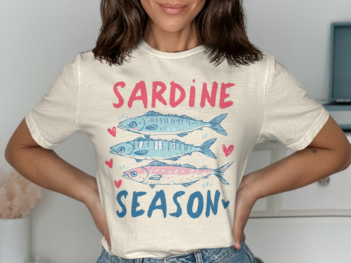 T-shirt with "Sardine Season" text and three cartoon sardines.