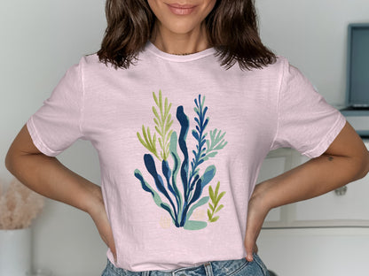 Light pink t-shirt with a blue and green abstract floral graphic.