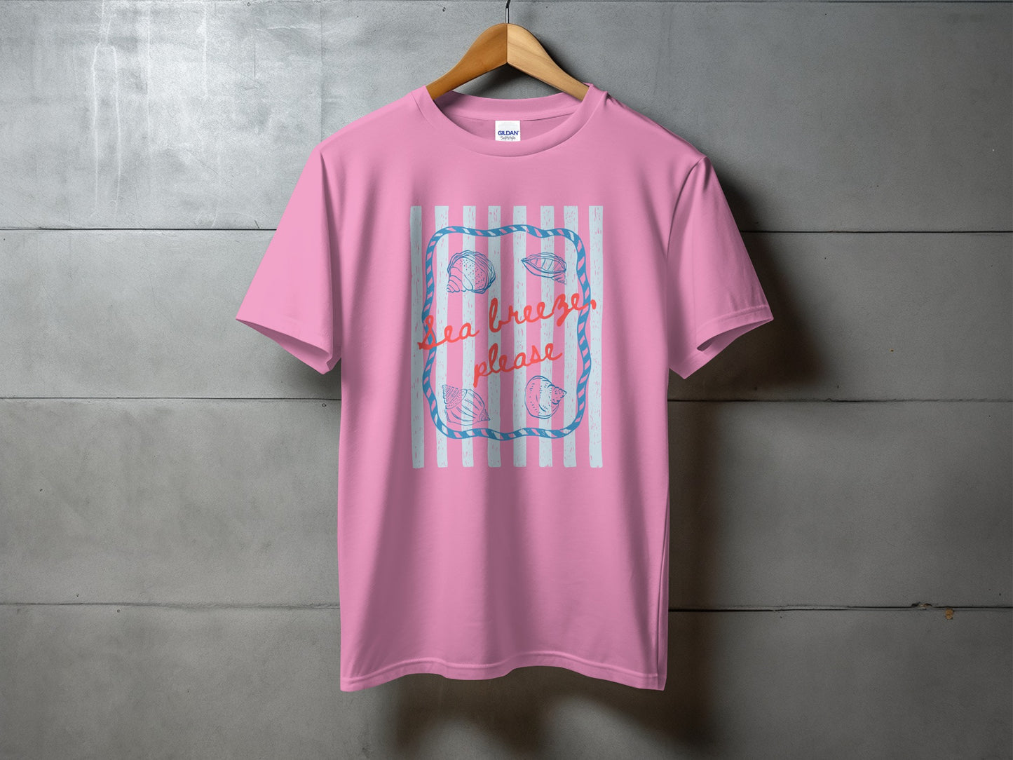 Pink t-shirt with "Sea breeze please" text and a seashell design.