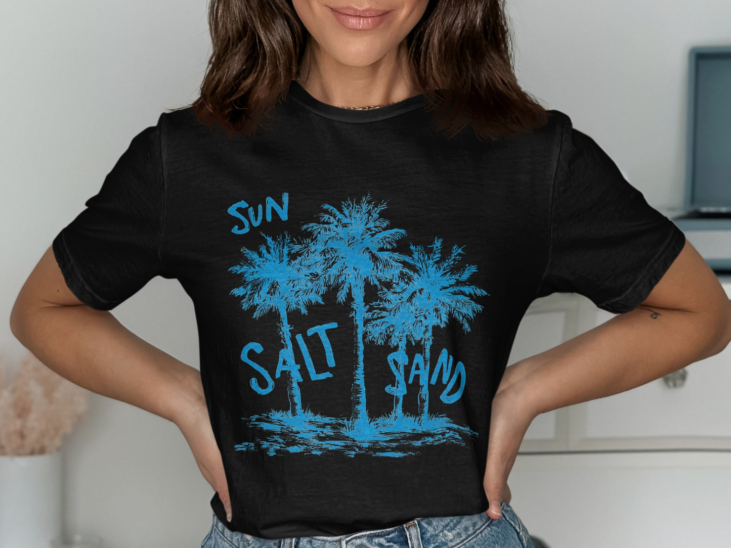 Black t-shirt with blue palm trees and "SUN SALT SAND" text.
