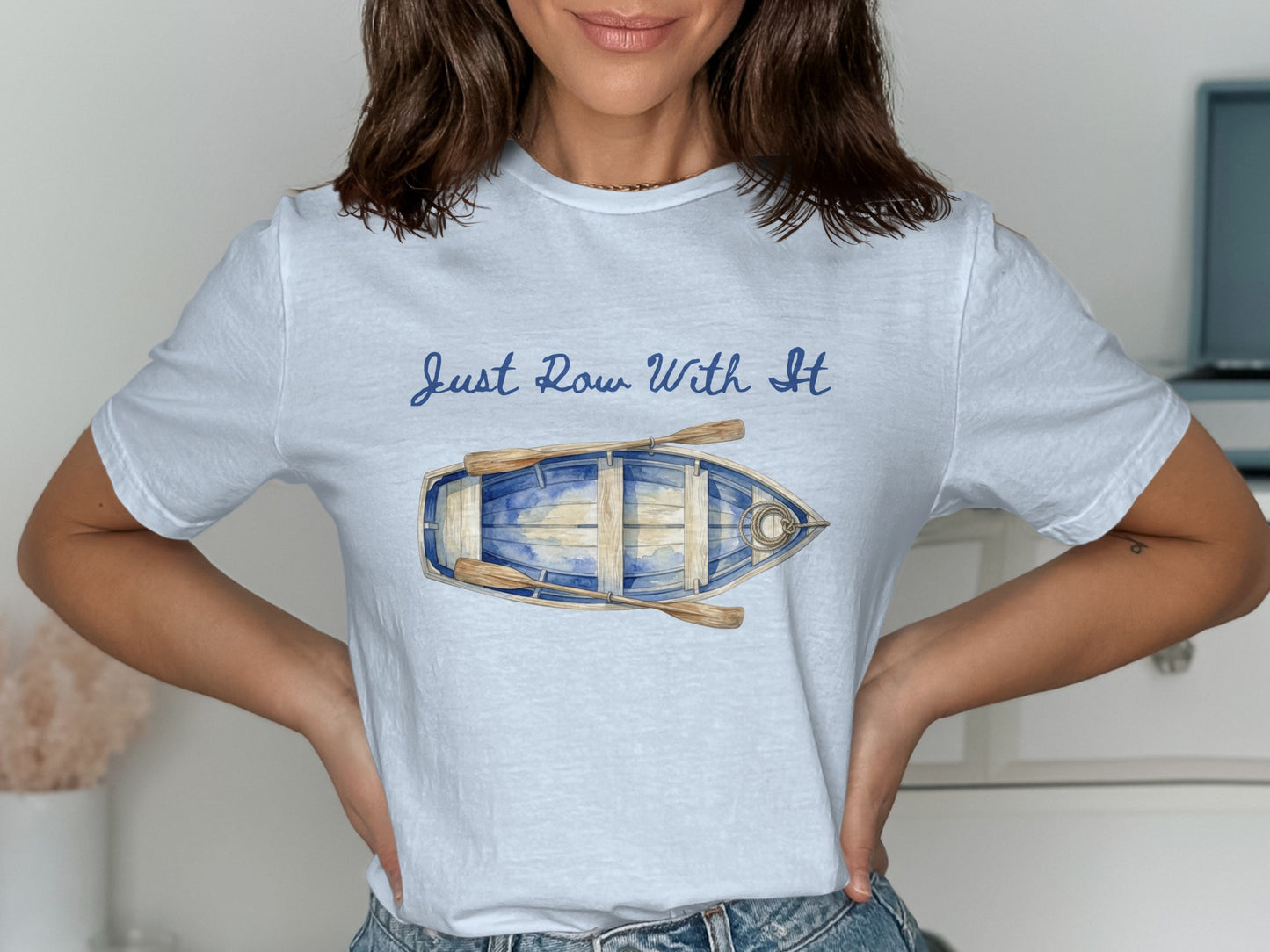Light blue t-shirt with oars and "Just Row With It" text.