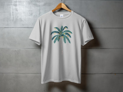 White t-shirt with a green palm tree illustration and yellow coconuts.