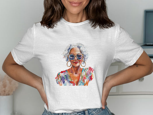 Woman wearing white t-shirt with colorful portrait of stylish older woman.