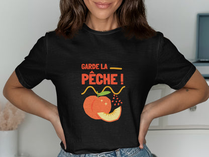 Black t-shirt with "Garde la pêche!" slogan and peach graphic.
