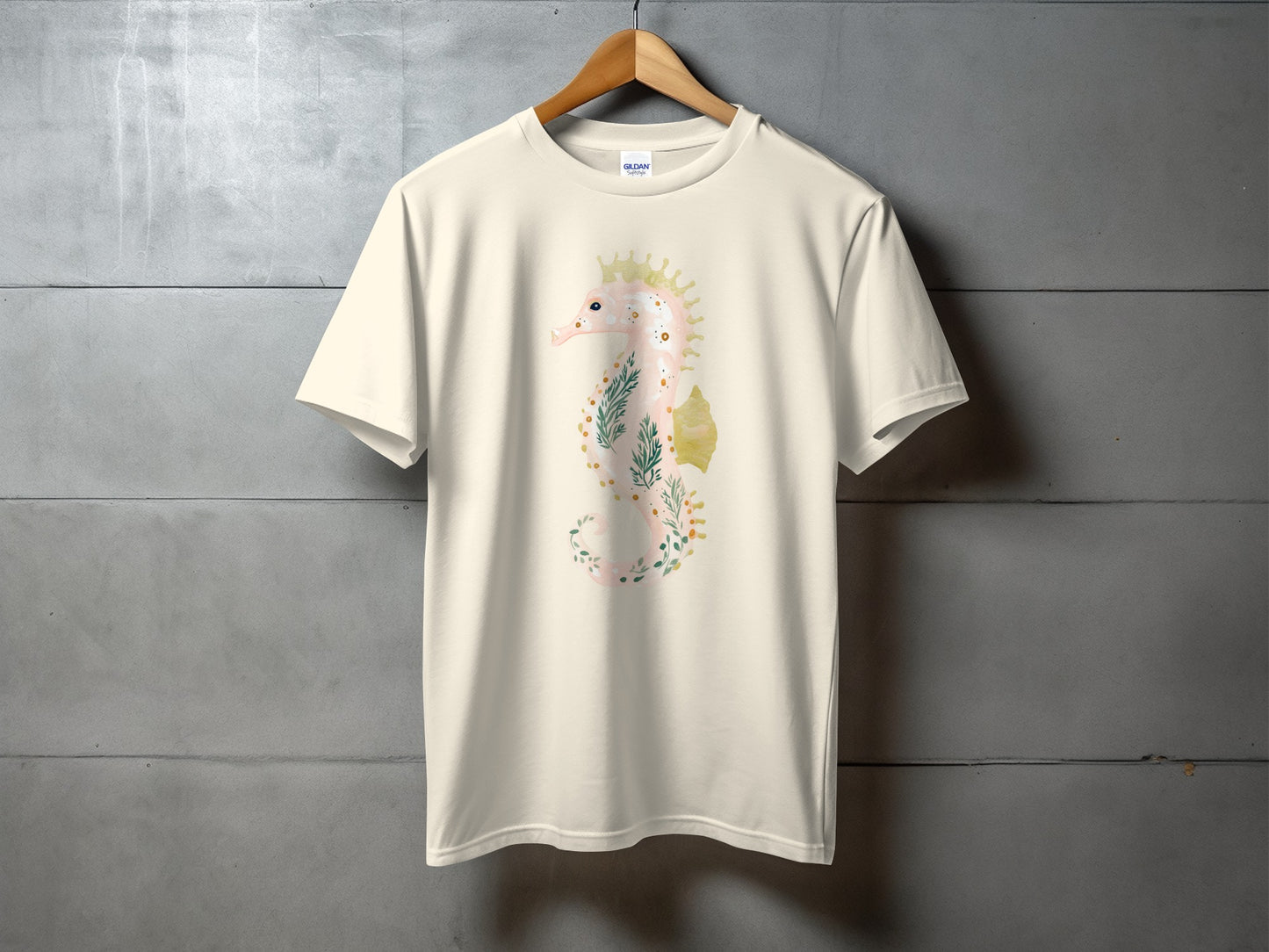 Cream t-shirt with a floral seahorse graphic on the front.