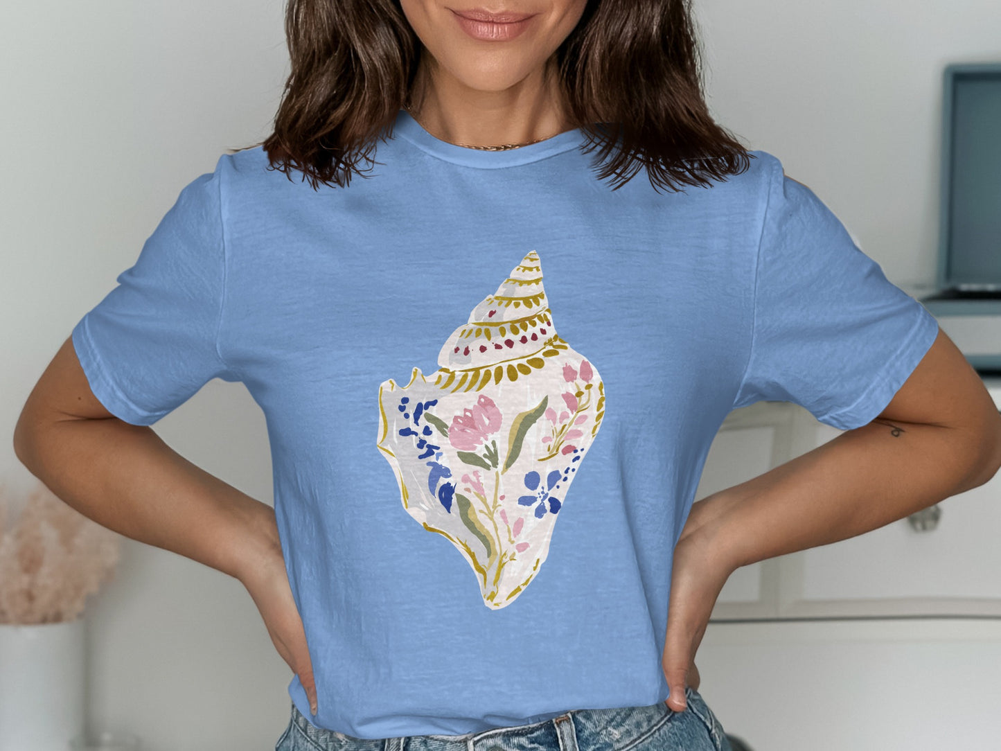Light blue t-shirt with a detailed seashell floral design.