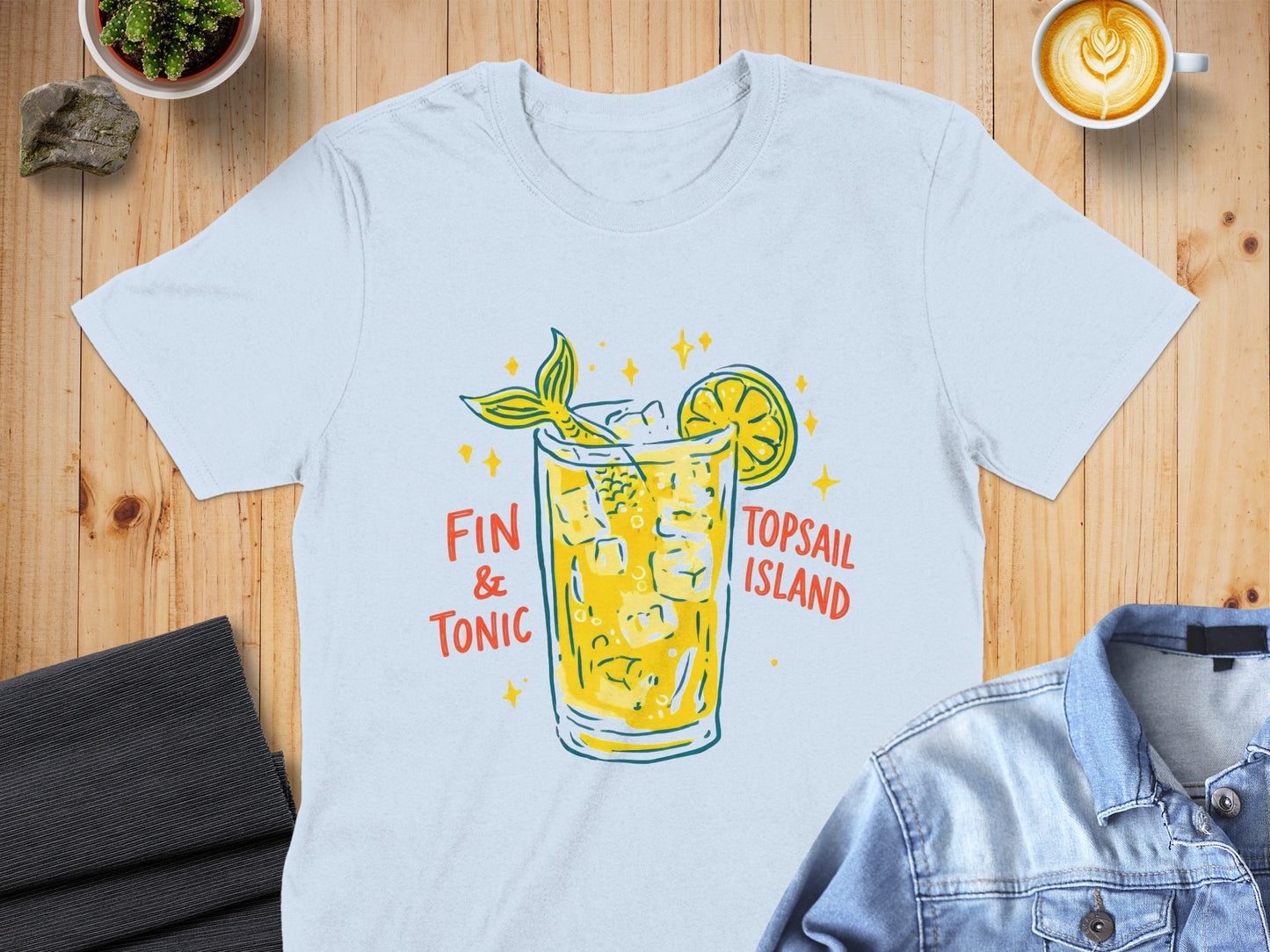 White t-shirt with yellow "Fin & Tonic" cocktail graphic and "Topsail Island" text.