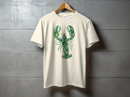 Cream t-shirt with a green, ornate lobster graphic.