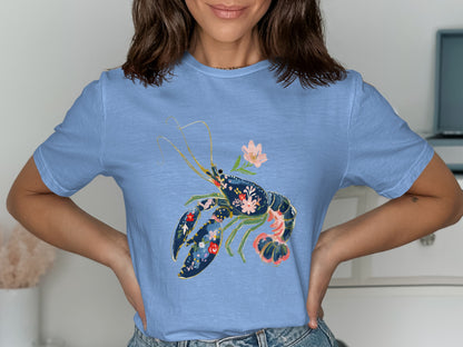 Blue t-shirt with a navy lobster graphic filled with colorful flowers.