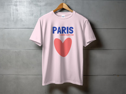 Light pink t-shirt with "PARIS L'AMOUR DANS L'AIR" and a red heart.