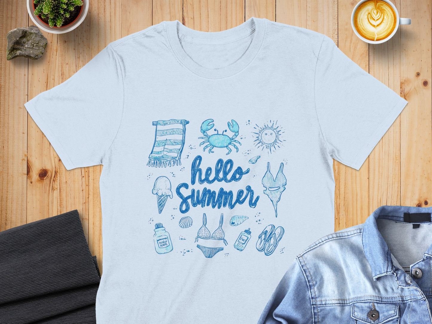 Light blue t-shirt with a "Hello Summer" design featuring beach icons.