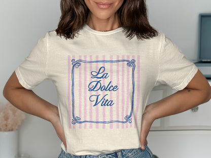 Cream t-shirt with "La Dolce Vita" text inside a decorative frame.