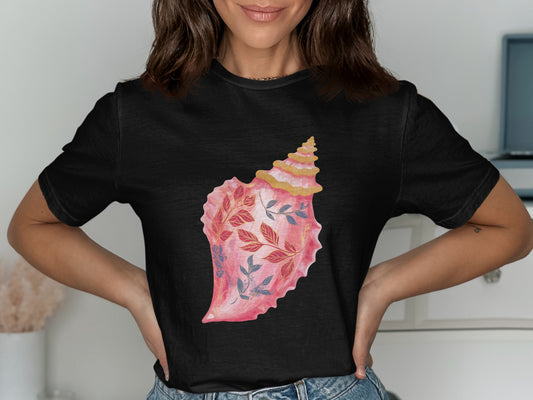 Black t-shirt with a watercolor seashell graphic featuring pink and blue floral accents.