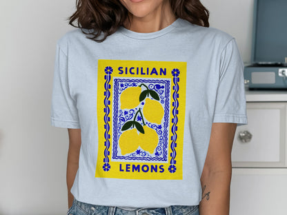 Light blue t-shirt with a graphic of three yellow lemons and "Sicilian Lemons" text.