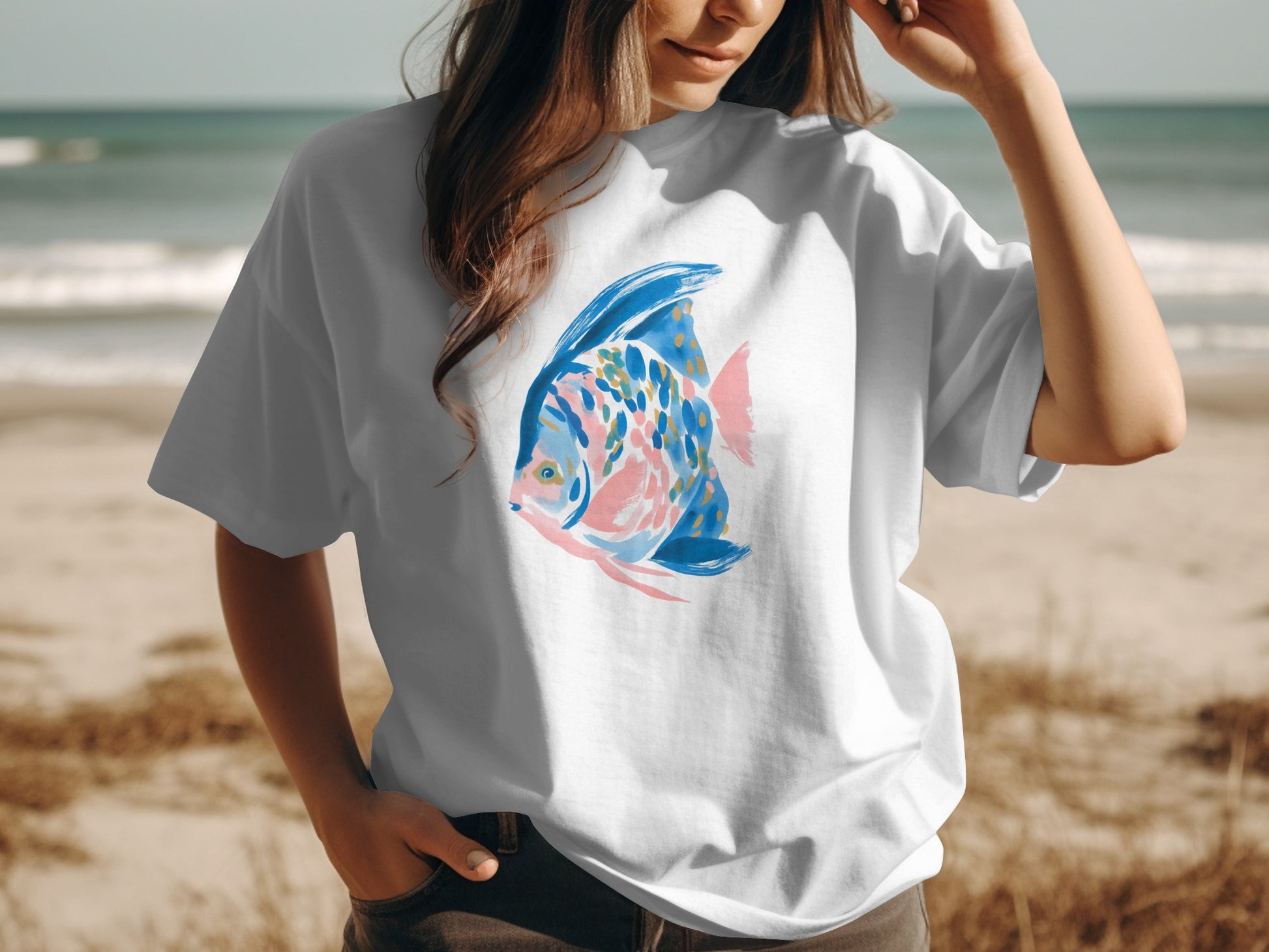 White t-shirt with a colorful watercolor fish design.