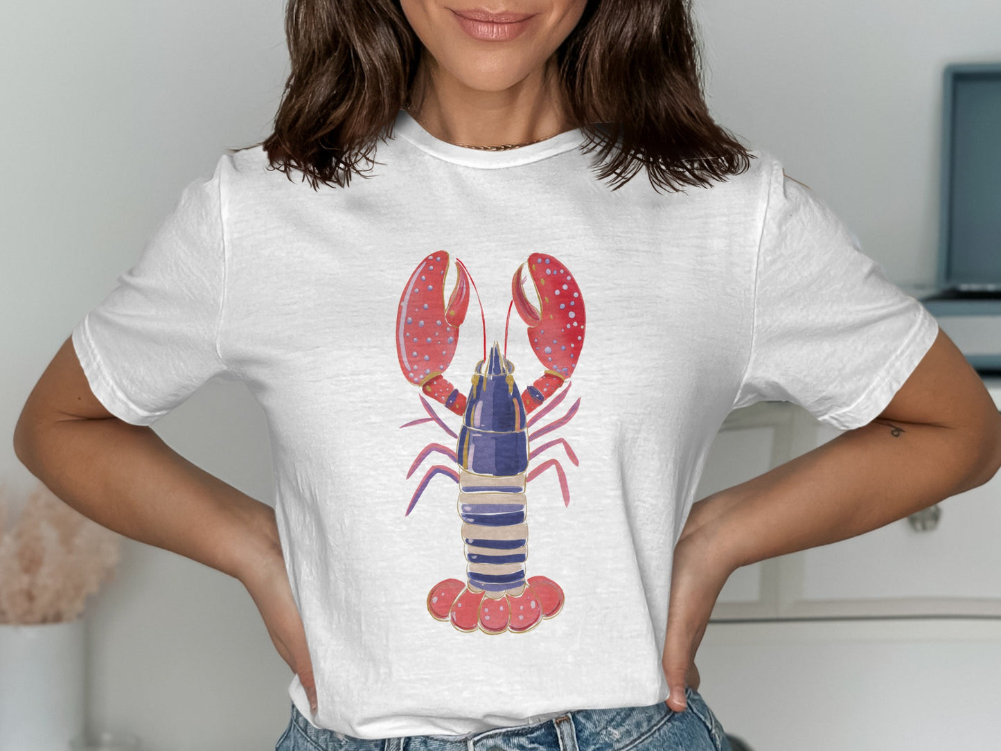 White t-shirt with a stylized blue and red lobster graphic.
