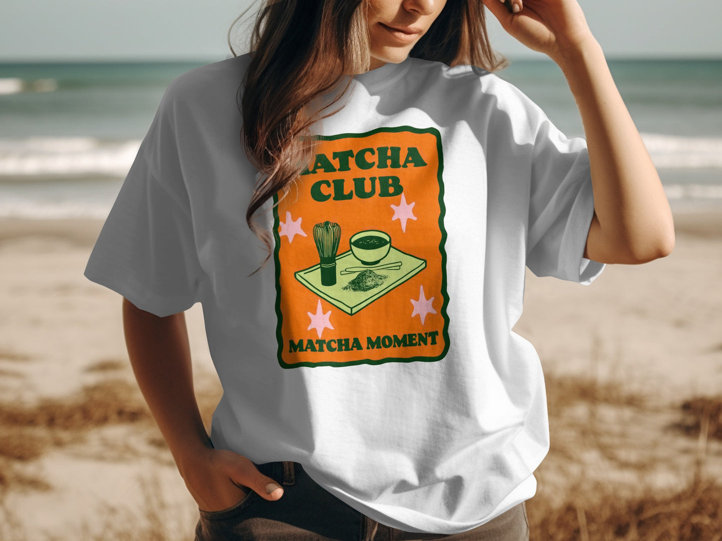 White t-shirt with green matcha bowl and whisk design.