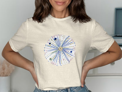 Cream t-shirt with watercolor illustration of a stylized sea urchin.